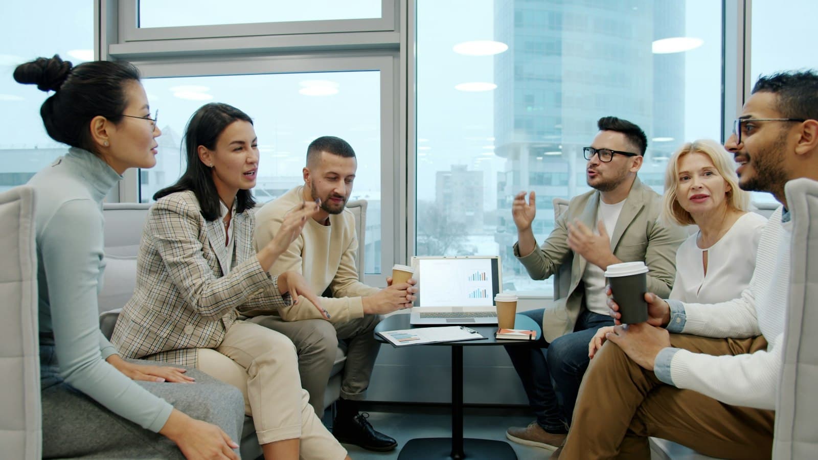 A team meeting together around a conference table